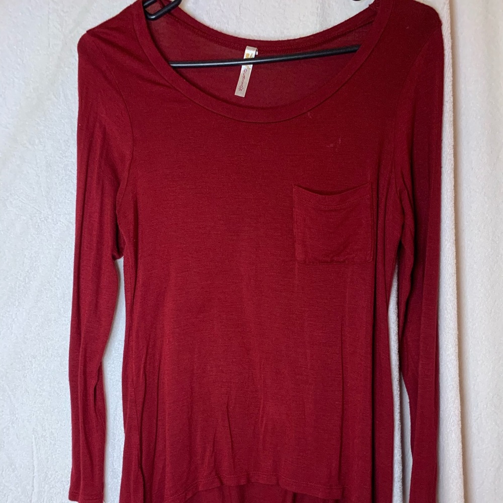 A long sleeve burgundy shirt